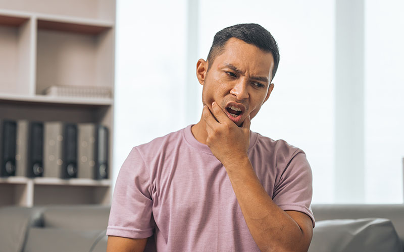 Central Dental Family - Patient experiencing a dental emergency